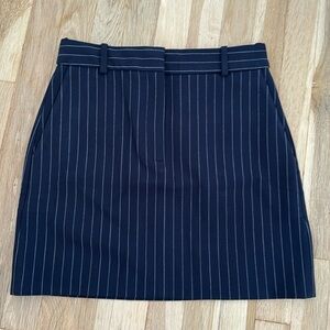 Aritzia Babaton navy blue pinstripe mini Chisel skirt size 4. New without tags